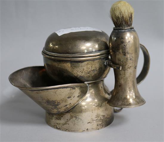 An Edwardian silver shaving mug with shaving brush, A & J Zimmerman, Birmingham, 1901/2, 13.2 oz.